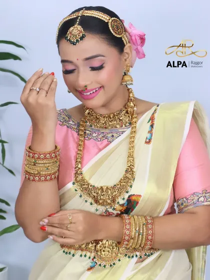 The bride admiring her bangles, a shot that highlights the intricate jewelry.