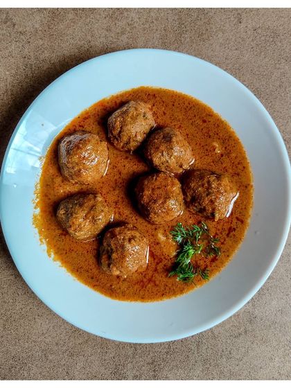 A closer look at the Khaima Unde Saaru, my family's heirloom lamb meatball curry. The gravy is rich and packed with flavours that ooze from the meatballs, which are made with homemade masala and fresh herbs.