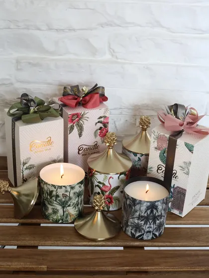 A trio of our tropical-themed scented candles, each with its own unique print and elegant gift box. They are perfect for gifting or for creating a cohesive, fragrant display.