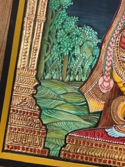 A close-up view of the detailed background and gesso work on the pillars in our Lord Vishnu painting. Every element is carefully crafted to create a complete and divine scene.