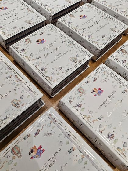 A collection of my signature book boxes, ready to be sent out. Each one is a work of art, designed to be a cherished keepsake long after the treats inside are gone.