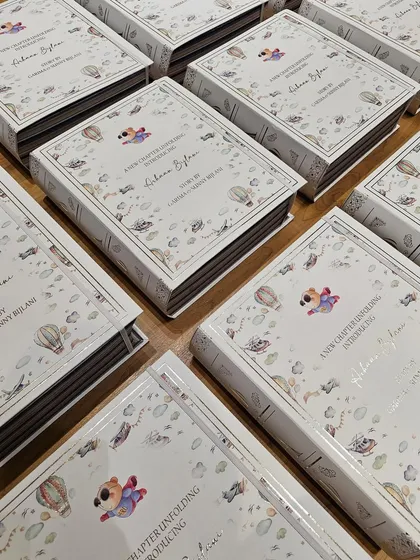 A collection of my signature book boxes, ready to be sent out. Each one is a work of art, designed to be a cherished keepsake long after the treats inside are gone.