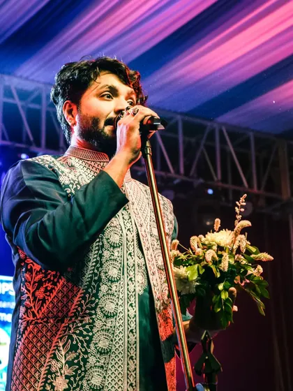 Receiving a token of appreciation from the college. It's always an honor to perform for the youth and be a part of their college memories.