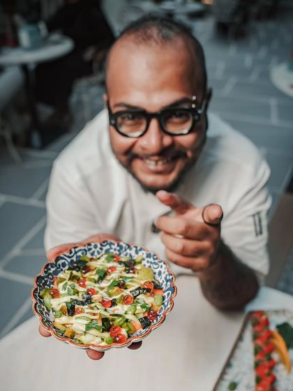 Chef Viveq presents his Chirashizushi, a vibrant canvas of premium sashimi, citrus-marinated vegetables, and delicate offcuts.