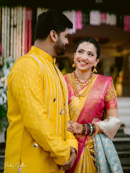A shared glance between Maithili and Dhruv. This candid shot captures the natural interaction and affection that make couple portraits so special.
