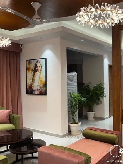 We love playing with color to reflect our client's personality. This living room combines olive green sofas with dusty rose curtains and accent furniture, creating a vibrant yet sophisticated space. The custom furniture and curated art piece complete this unique look.