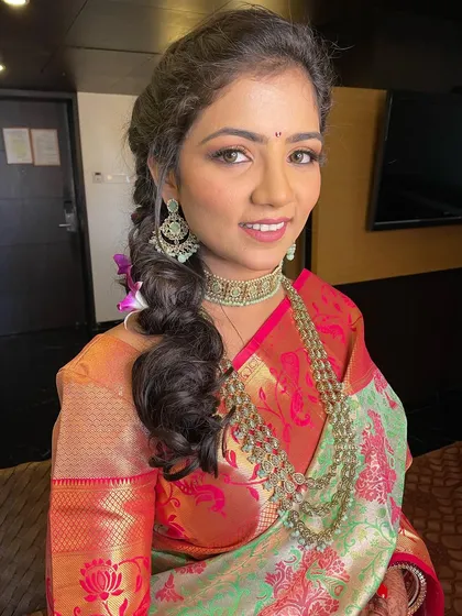 A smiling portrait of the bride, looking fresh and happy.