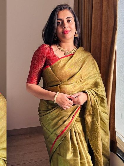 A portrait in our copper-colored tissue saree. The rich fabric has a beautiful texture and a subtle red border that adds a pop of color.