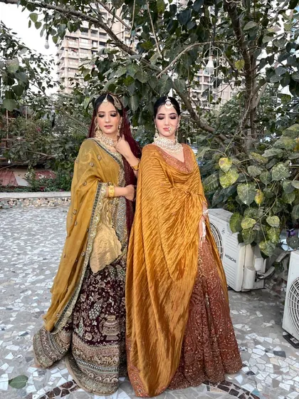 A beautiful shot of two of our campaign models. This showcases the versatility of my work, with two distinct yet complementary bridal styles.