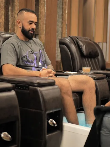 Self care is for everyone. Here, a client unwinds while receiving a professional pedicure in our comfortable, dedicated grooming station. We provide a relaxing environment for men to enjoy essential foot care services.