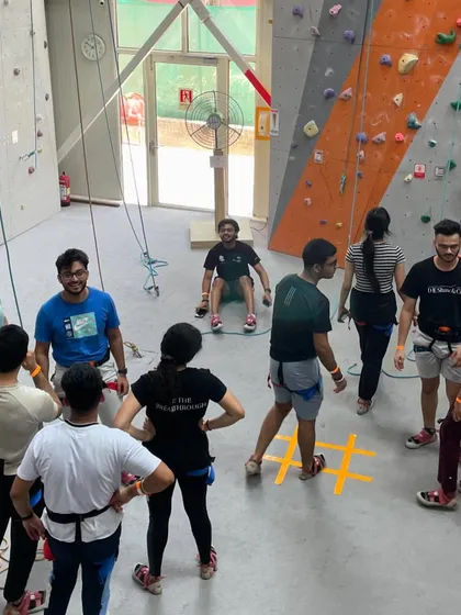 Getting the team together for a pre-climb huddle. I structure my corporate days to include both instruction and free time for organic team interaction.