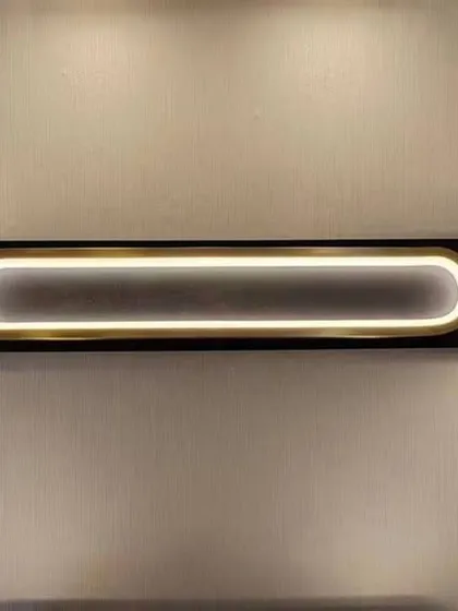 A modern vanity light with a sleek, linear design and adjustable end caps. Perfect for providing even lighting over a bathroom mirror.