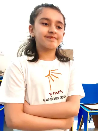 A student confidently sporting her Prath t-shirt. It's more than just a shirt; it's a symbol of her identity as a young artist.