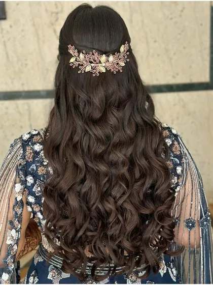 Let your hair dance freely. For this sangeet look, I created these beautiful, defined waves and added a statement accessory for a touch of glamour.
