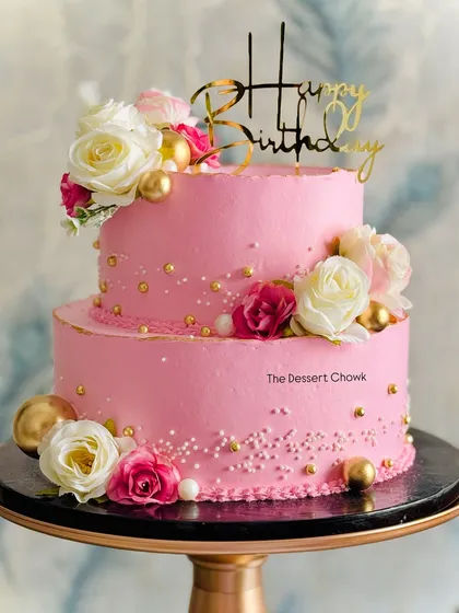 This two-tier pink floral cake is perfect for a sweet and elegant birthday celebration. I used fresh flowers and delicate gold and pearl sprinkles to create a soft, romantic feel.
