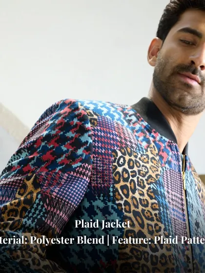 A detail shot of the plaid jacket, emphasizing the eclectic mix of patterns and the quality of the polyester blend fabric. This is a piece designed to stand out.