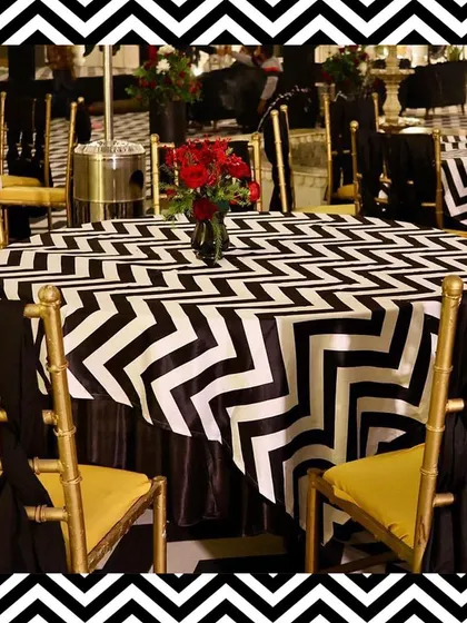 The guest tables were covered in black and white zigzag-patterned cloths, perfectly matching the dance floor and the overall modern theme.