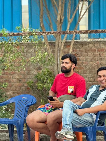 Watching the game unfold. As a coach, observing from the sidelines is as important as directing the play.