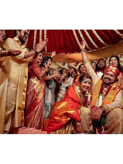 The joy on everyone's faces says it all. This photo captures the celebratory spirit of the wedding ceremony perfectly.