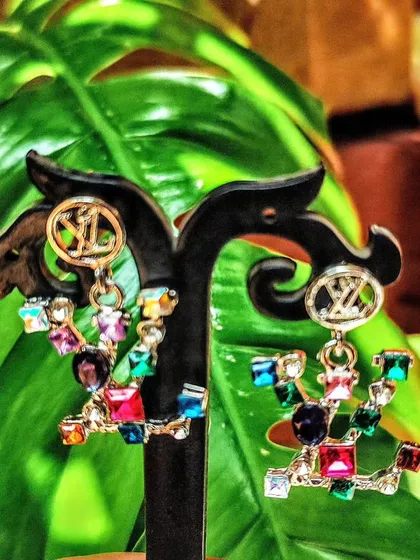 Part of my curated Autumn collection, these multi-coloured crystal earrings add a playful and luxurious touch. They are perfect for anyone who loves a bit of sparkle and high-fashion inspired designs.