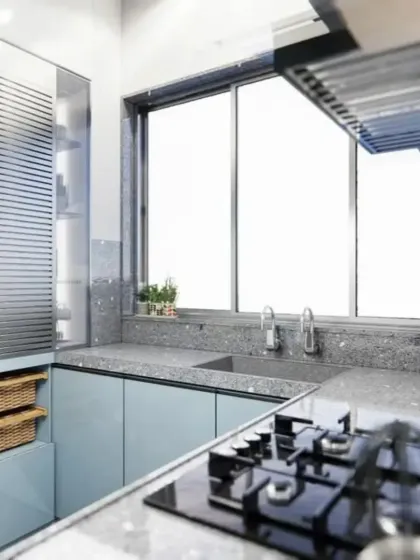 This angle shows the smart storage solutions, including a vertical pantry with wicker baskets, perfect for organizing your kitchen.