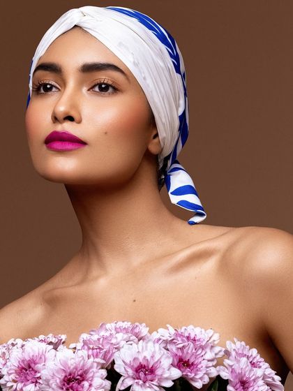 Another angle from the beauty shoot, highlighting the vibrant pop of magenta on the lips against the clean, fresh makeup.