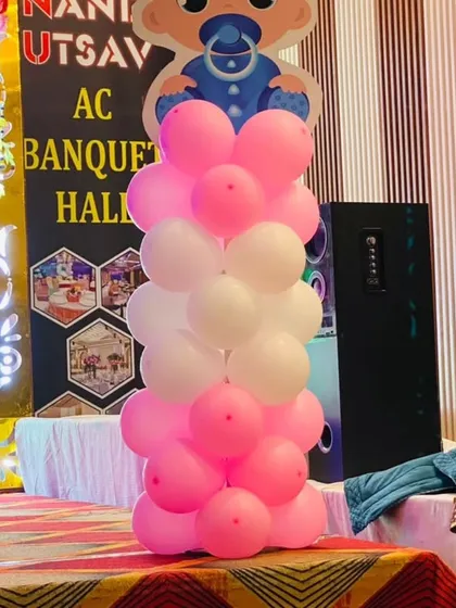 A simple balloon pillar with a baby cutout and 'BABY' blocks, perfect for adding a decorative touch to a Naming Ceremony stage.