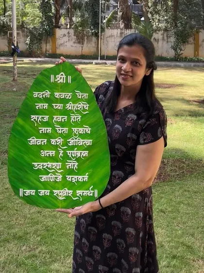A proud photo with the large, leaf-shaped 'Vadani Kaval' hanging before it was packed and shipped.