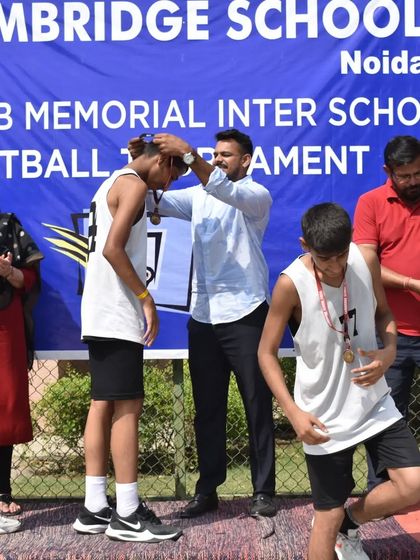 Awarding medals to the deserving players. Recognizing their hard work is an important part of their journey.