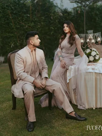 A formal portrait with a touch of classic elegance. The couple's pose in a beautiful garden setting for their Roka ceremony feels both timeless and sophisticated.