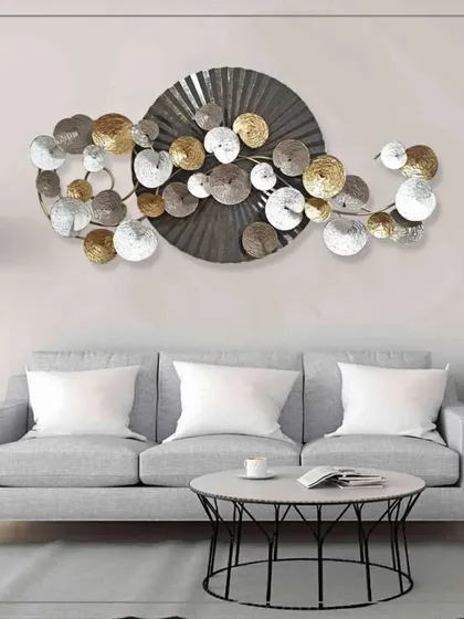Add a creative and classy vibe to your interior with this abstract metal art. A large central disc is surrounded by a throng of smaller, multi-toned circles, creating a dynamic and visually engaging piece that enriches any room's ambiance.