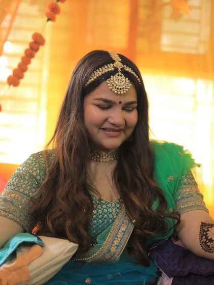 A candid moment of a bride getting her mehendi done. I always ensure my brides are comfortable and relaxed throughout the process.
