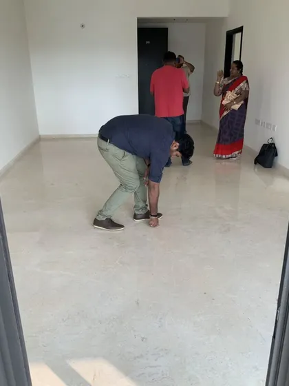 Checking the flooring for levelness and finish is a crucial part of our quality audit. We ensure that every square foot of the space is built to the highest standard.