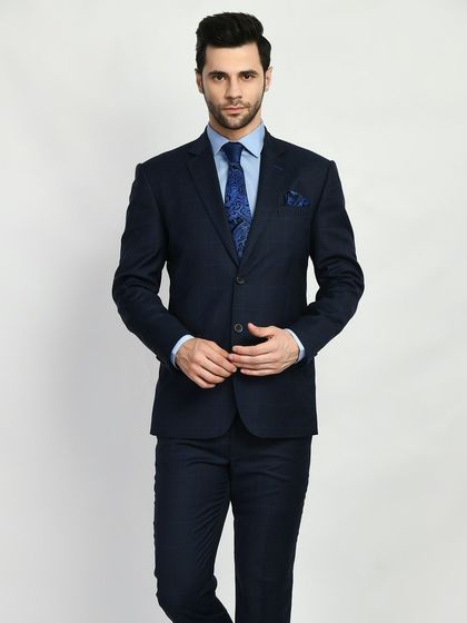 A classic navy suit, the cornerstone of any professional wardrobe. My bespoke version ensures a perfect fit, elevating this essential piece from standard to exceptional.