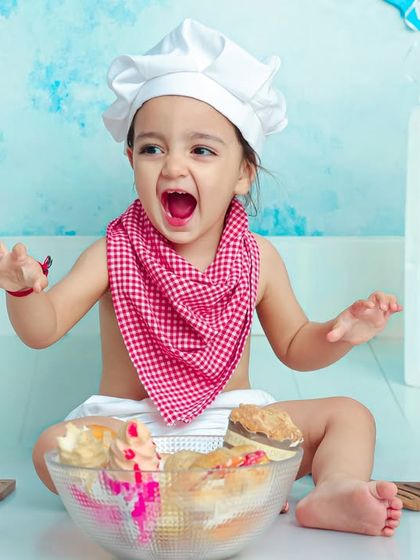 A passionate cry from the head chef. This expressive and funny shot perfectly captures the drama and fun of a toddler in the "kitchen".