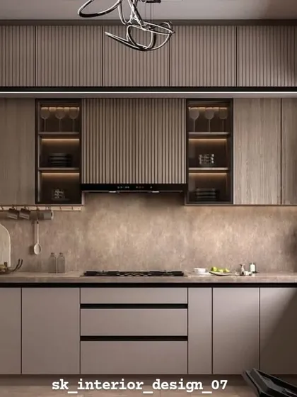 A kitchen design with textured laminate cabinets and fluted glass details. The hanging rack for utensils and the modern chandelier add both function and style.