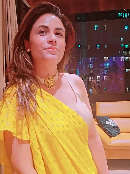 This shot focuses on the beautiful gold temple-style choker, showing how a single piece of jewelry can become the centerpiece of an ethnic outfit.
