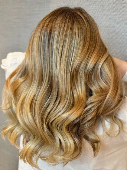A stunning pearl blond hair colour balayage, with cool, shimmering tones.