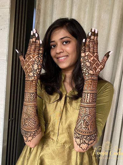 My lovely NRI bride from the US, showing off her beautiful front and back hand mehendi designs.