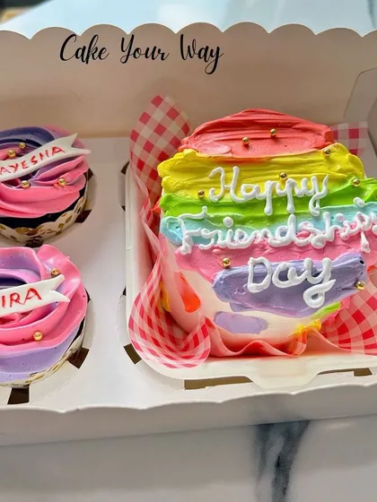 Celebrating friendship with a colorful bento cake and matching cupcakes. I can personalize the cupcakes with names for a truly special touch.