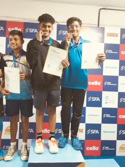 Aryan and his partner on the top of the podium, receiving their gold medals at the SFA Championship.