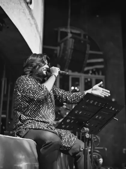 A black and white photo that emphasizes the classic and timeless nature of our music, focusing on the artist and his craft.