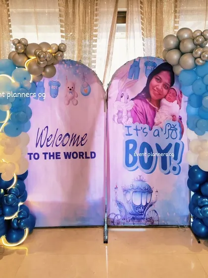 Another view of the "Welcome to the World" decor with silver and blue balloon arrangements.