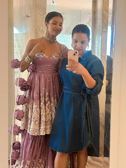 A full-length selfie with the lovely Nancy Tyagi, showcasing her complete look with the stunning pearl-adorned braid I created for her.