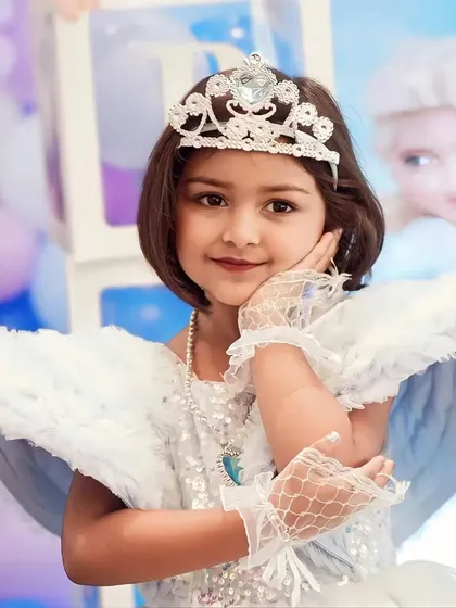 A portrait of the birthday princess in her Frozen-themed dress. Our goal is to create an immersive experience where the birthday child is the star of their own fairytale.