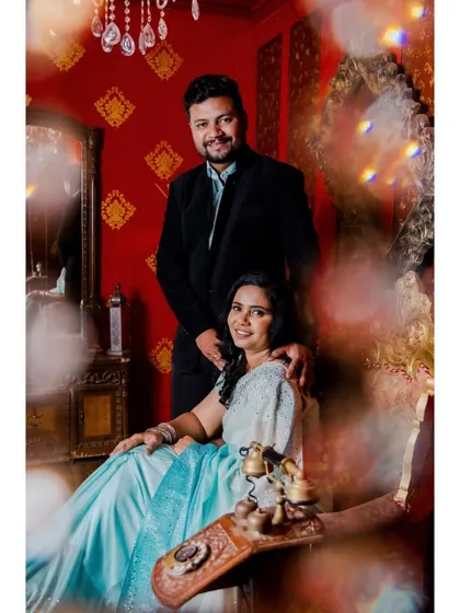 A vintage-themed pre-wedding photo, using soft lighting and classic props like an old telephone to create a nostalgic and romantic mood.