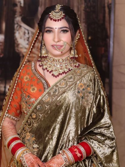 This bride opted for a unique olive green velvet lehenga. I designed the makeup to complement the rich tones of her outfit, with warm, earthy shades on the eyes and a radiant complexion.