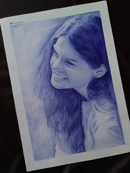 The finished version of the candid portrait, done entirely in blue ballpoint pen. The final piece emphasizes the texture of her flowing hair and her joyful expression, creating a timeless piece of art.