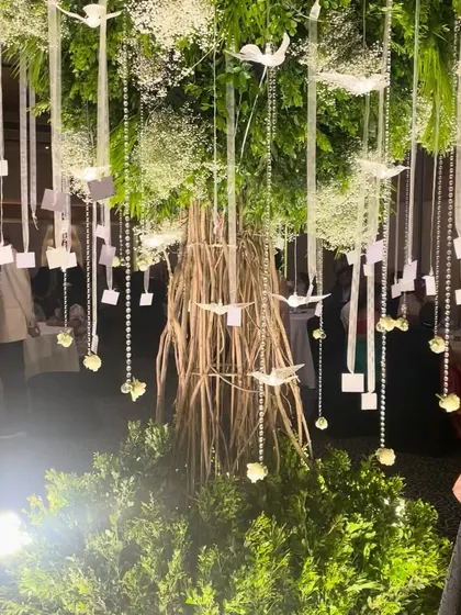 A closer look at our custom-built "Wish Tree." We hung crystals, acrylic birds, and personalized wish cards from its branches, creating an interactive and meaningful centerpiece for the reception.
