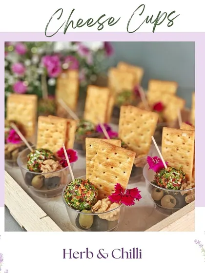 Our Herb & Chilli cheese cups. These individual portions are perfect for parties, offering a convenient and delicious way for guests to enjoy our handcrafted cheese.